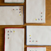 Nazaré ecru cotton table linen with embroidered flowers