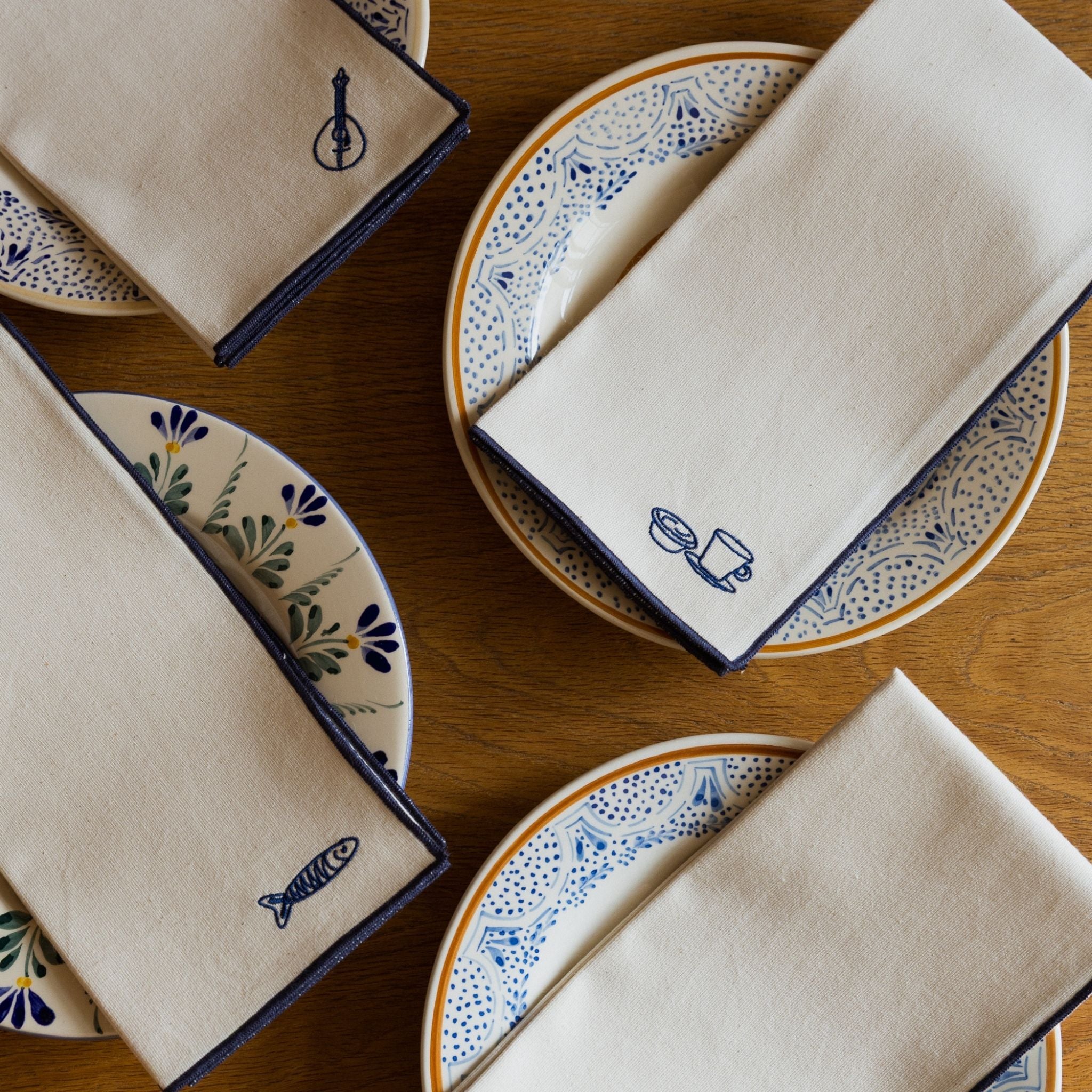 Nazaré ecru cotton table linen with embroidered Portugal-inspired motifs