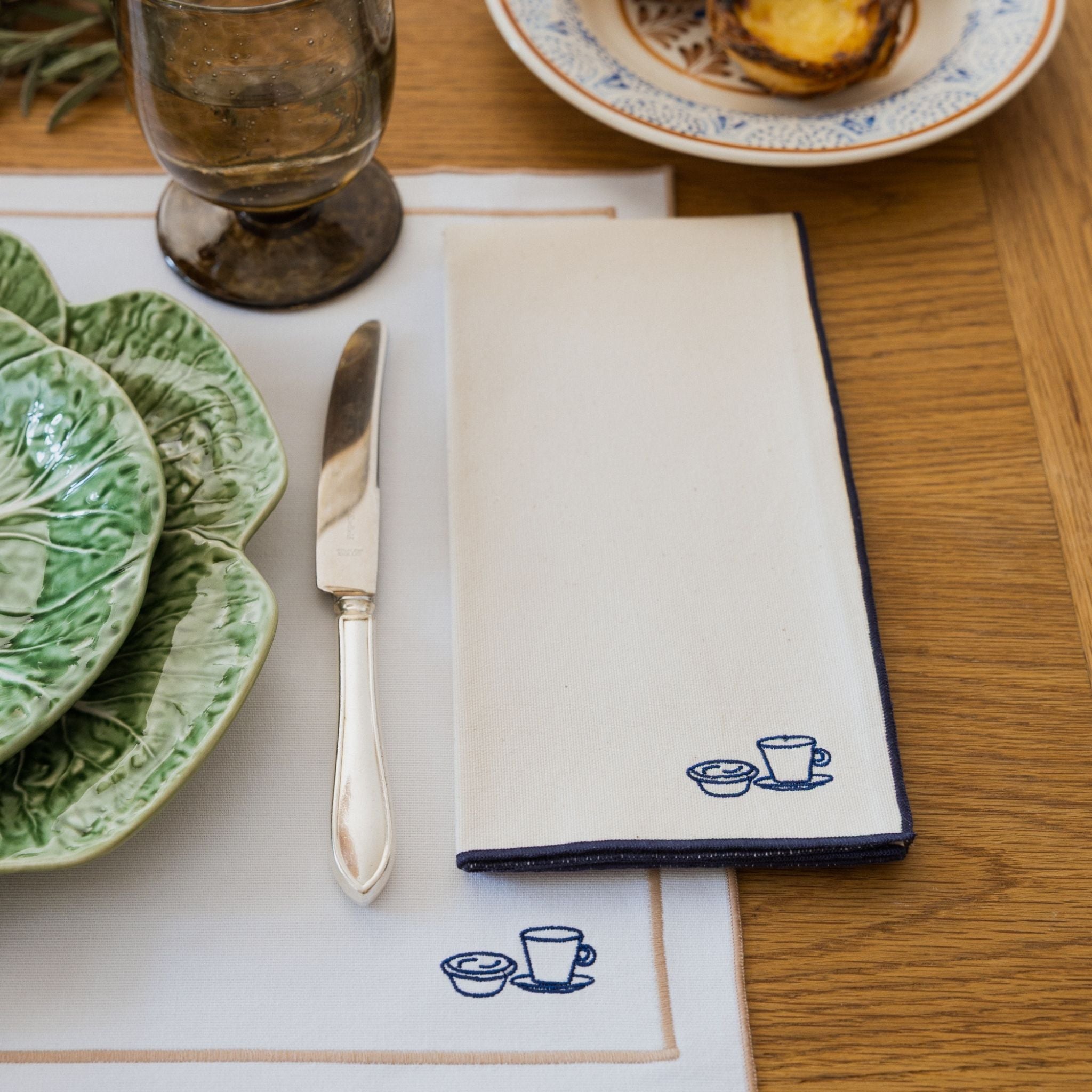 Nazaré white cotton table linen with embroidered Portugal-inspired motifs
