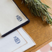 Nazaré white cotton table linen with embroidered Portugal-inspired motifs
