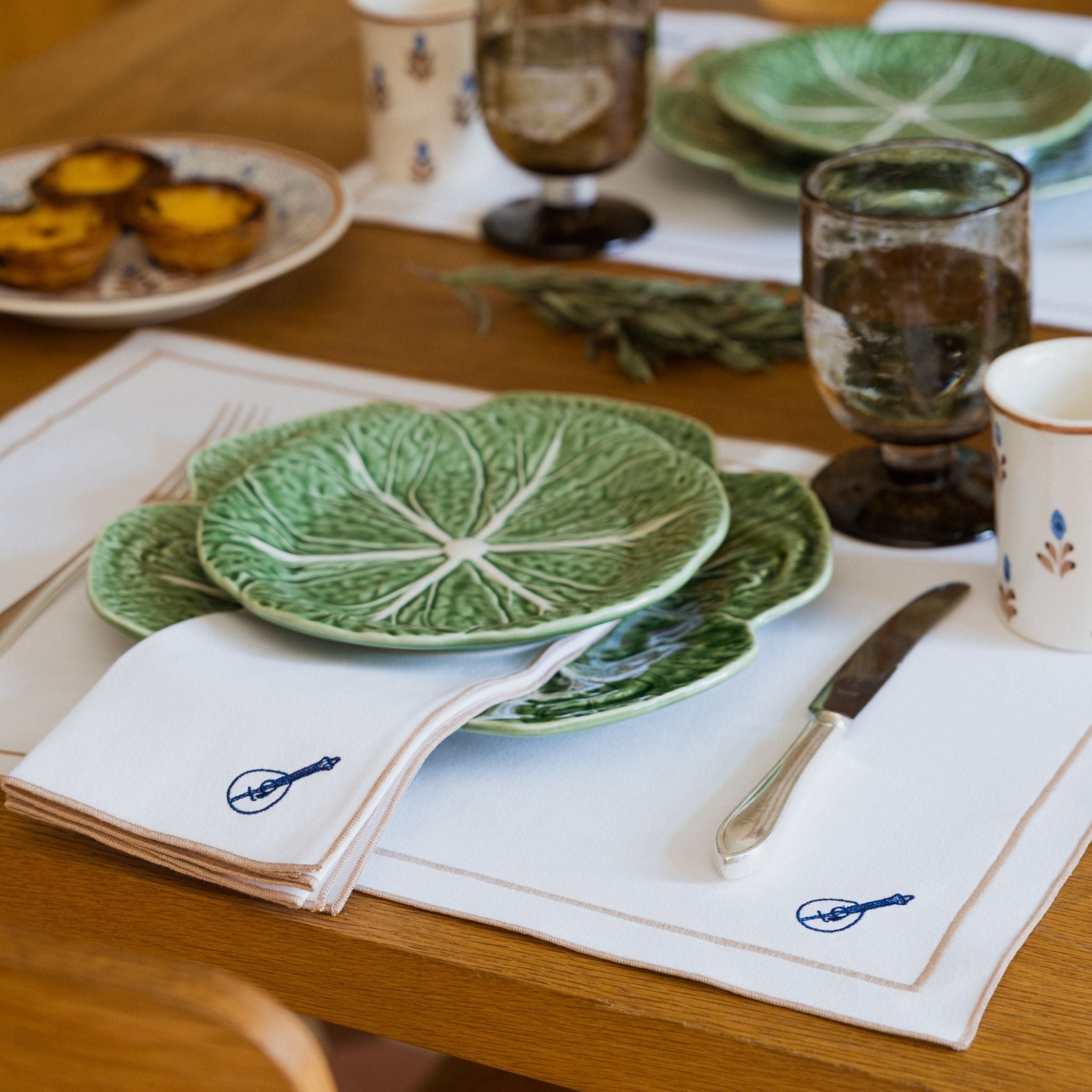 Nazaré white cotton table linen with embroidered Portugal-inspired motifs