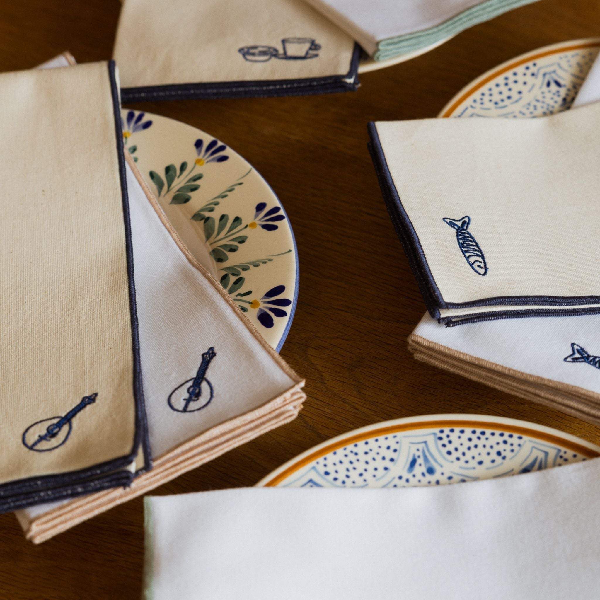 Nazaré white cotton table linen with embroidered Portugal-inspired motifs